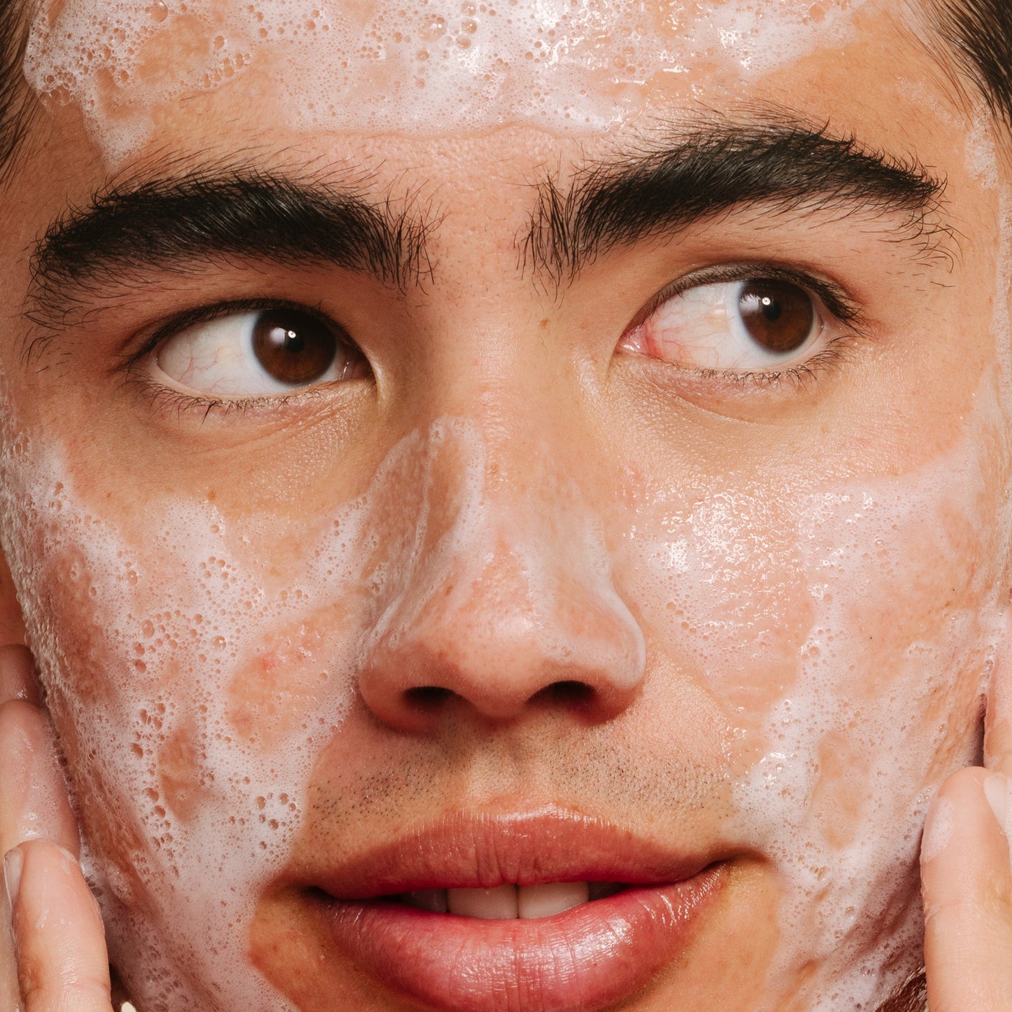 Male model with foam on face 