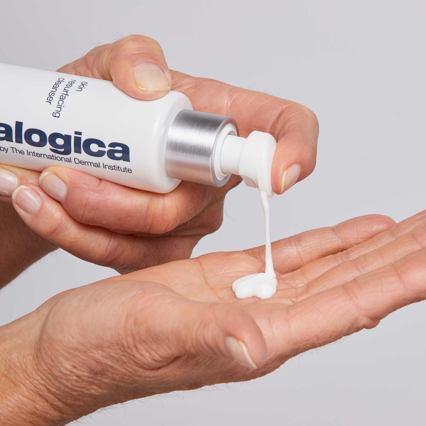 skin resurfacing cleanser being dispensed into hand 